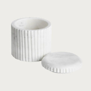 Ribbed marble apothecary jar shown with the lid removed, revealing the interior storage space
