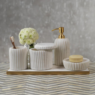 Ribbed marble apothecary jar styled on a bathroom counter alongside the matching Ribbed Marble Tumbler