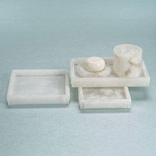 Round alabaster soap dish shown close up highlighting the circular silhouette and stone veining