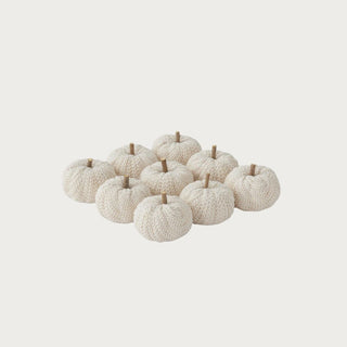 Set of nine cream knit filler pumpkins with natural stick stems, each approximately 2.5 inches high and 3 inches wide, for fall bowl and tray decor.