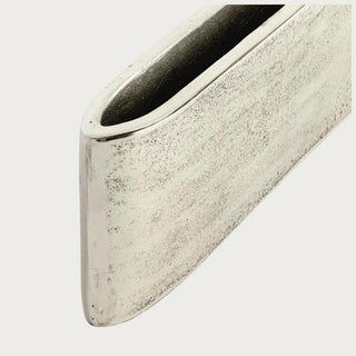Silver aluminum Joss Vase shown empty from an alternate angle highlighting its low horizontal profile