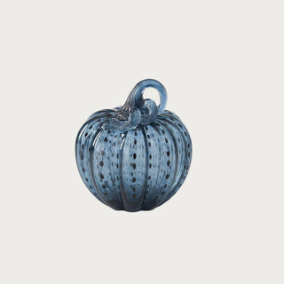 Small blue speckled handblown glass pumpkin measuring 6.25 inches high with ribbed glass, dark dotted detailing, and a looping glass stem.