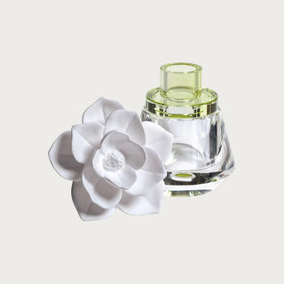 The Isabella Porcelain Diffuser shown at an angle highlighting the porcelain flower topper detail