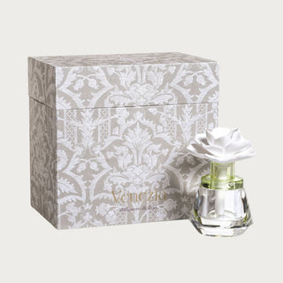 The Isabella Porcelain Diffuser with crystal-shaped glass body and white porcelain flower topper, front studio view
