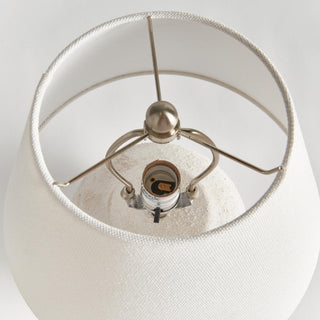 The Theo Table Lamp styled on a home office desk, textured ceramic body with linen shade, Third & Main