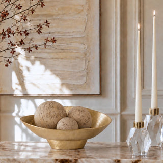 Three natural travertine decorative orbs in 3-inch, 4-inch, and 5-inch sizes grouped together, showing varied cream-beige tones, veining, and mineral markings.