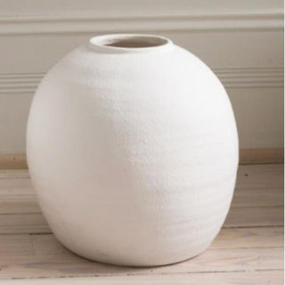 White Konos cement vase styled on a table, Third & Main